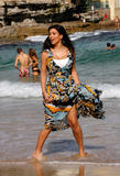 Kim Kardashian shows cleavage as she walks (fully clothed?!) at Bondi Beach in Sydney
